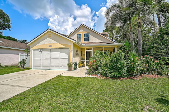 view of front of house featuring a front lawn and a garage