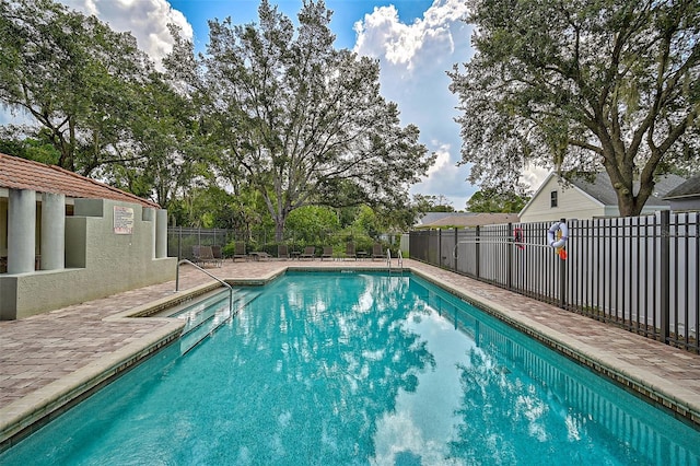 view of swimming pool featuring a patio area