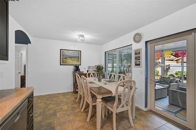 dining area with a textured ceiling