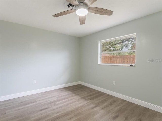 spare room with ceiling fan and hardwood / wood-style floors