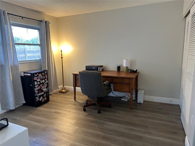 office space with wood-type flooring