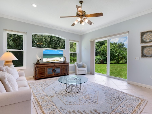 living area featuring tile patterned flooring, ornamental molding, and baseboards