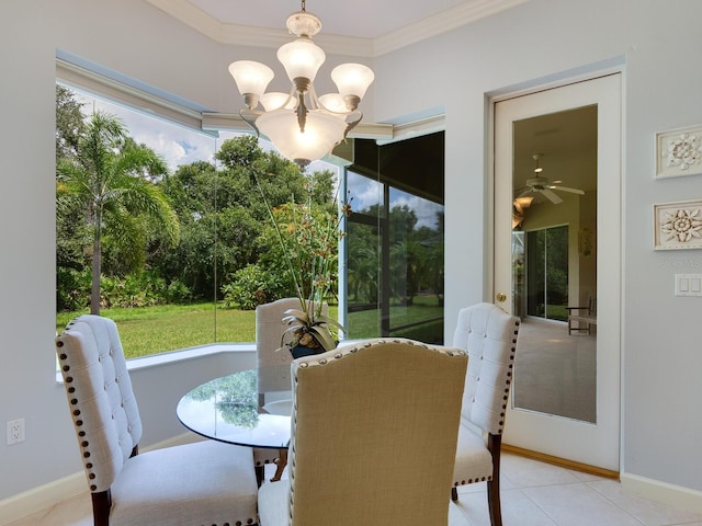 dining space featuring baseboards, ornamental molding, and an inviting chandelier