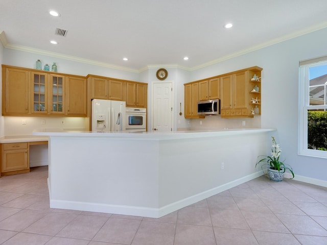 kitchen with white appliances, light countertops, open shelves, glass insert cabinets, and crown molding