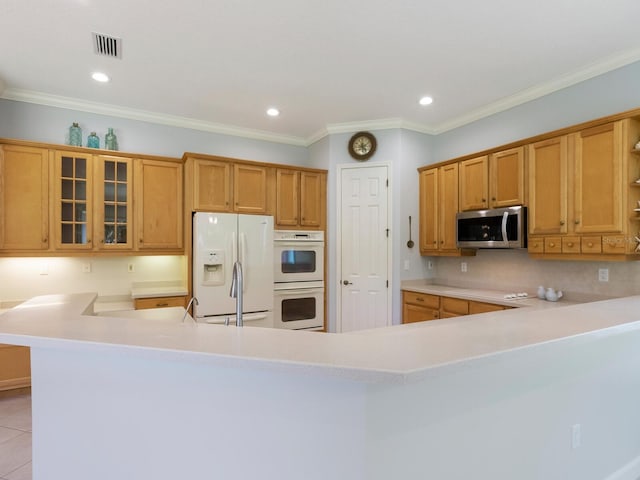 kitchen with open shelves, light countertops, visible vents, light tile patterned flooring, and white appliances