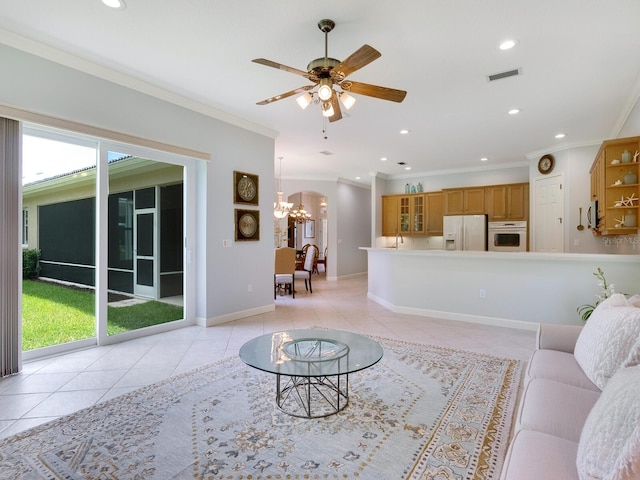 living room with recessed lighting, ornamental molding, light tile patterned flooring, baseboards, and ceiling fan with notable chandelier