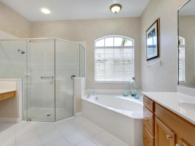 full bath with a shower stall, vanity, a bath, and tile patterned floors