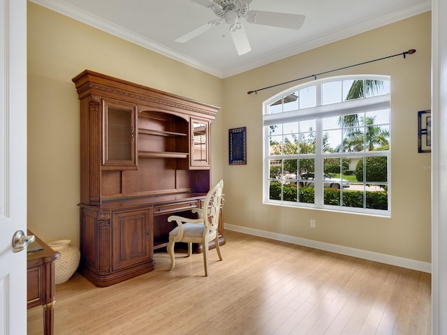 office area featuring baseboards, crown molding, and light wood finished floors