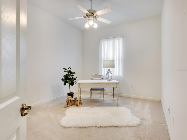 office featuring carpet flooring, ceiling fan, and baseboards