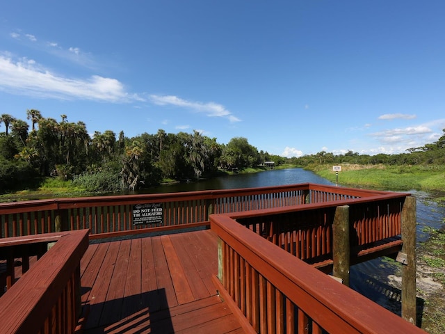 wooden deck featuring a water view