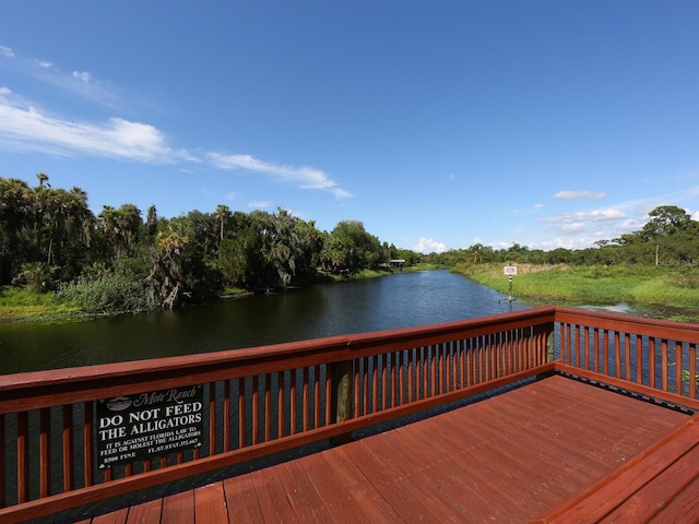 dock area with a deck with water view