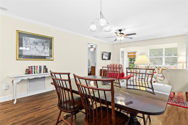 dining area featuring crown molding, hardwood / wood-style flooring, and ceiling fan with notable chandelier