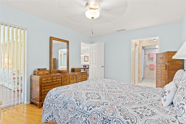 bedroom with light hardwood / wood-style flooring, connected bathroom, and ceiling fan