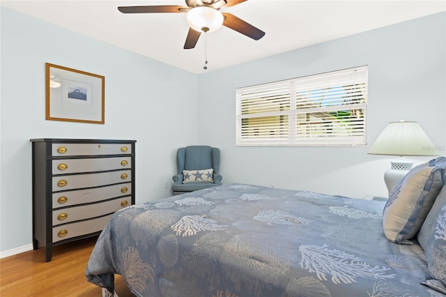 bedroom featuring ceiling fan and hardwood / wood-style flooring