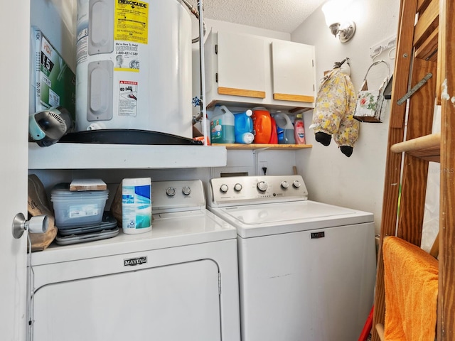 laundry area featuring water heater, independent washer and dryer, and a textured ceiling