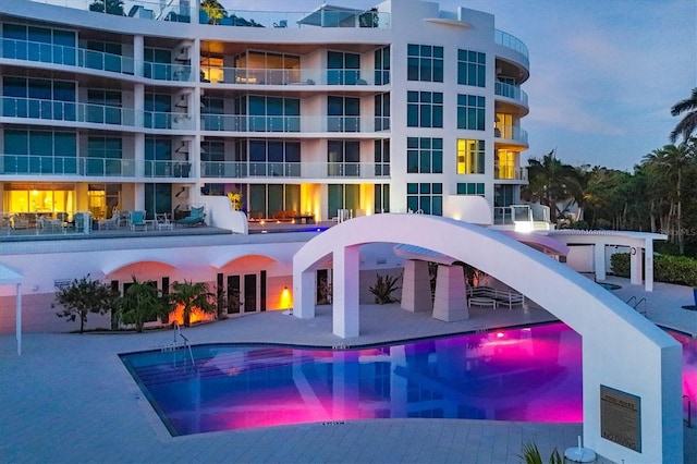 view of pool at dusk