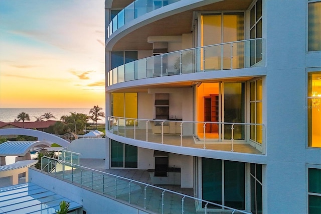 balcony at dusk with a water view