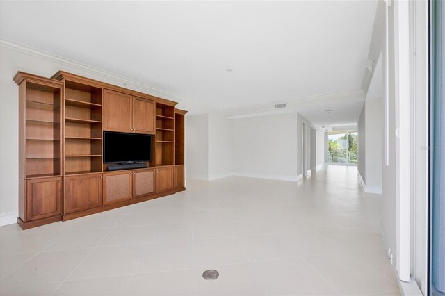 unfurnished living room featuring crown molding and light tile patterned floors