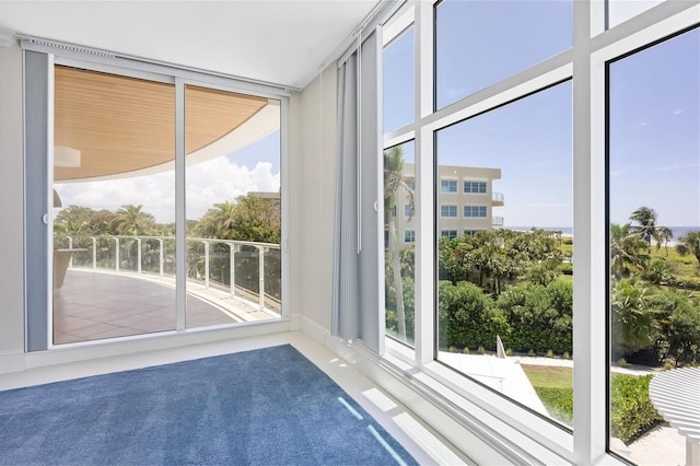 unfurnished sunroom with a wealth of natural light