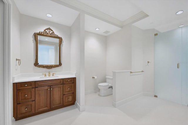 bathroom with crown molding, vanity, and toilet