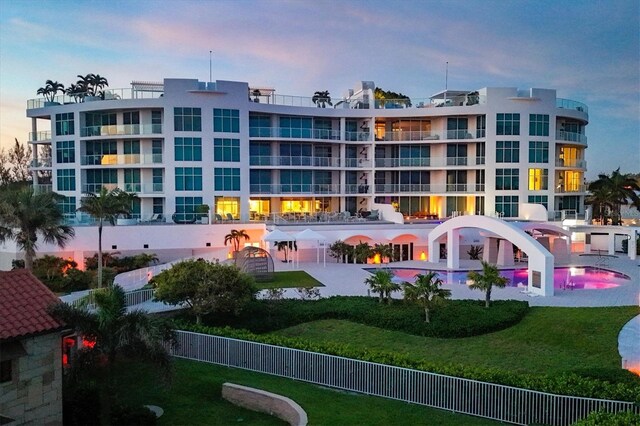 view of outdoor building at dusk