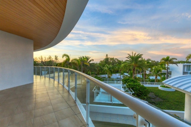 view of balcony at dusk