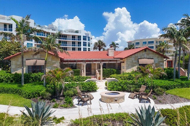 exterior space with an outdoor fire pit