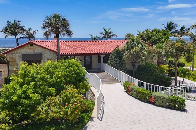 view of front of home with a water view