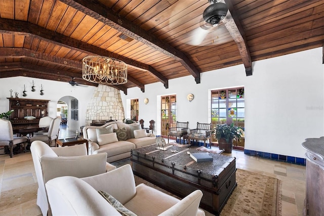 living room with beamed ceiling, ceiling fan with notable chandelier, and wooden ceiling