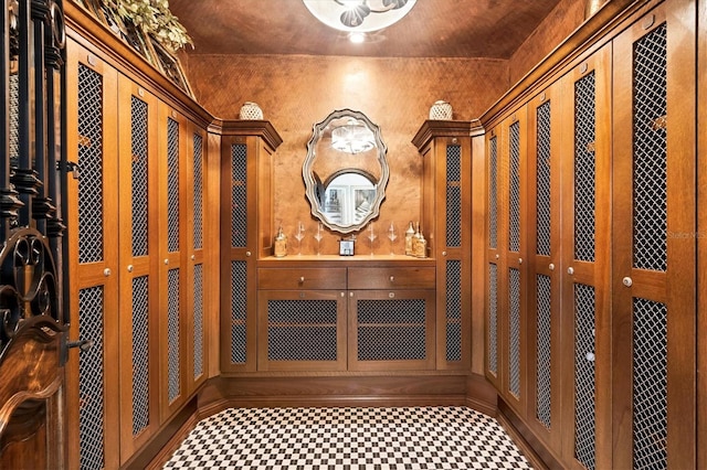 wine cellar featuring vaulted ceiling