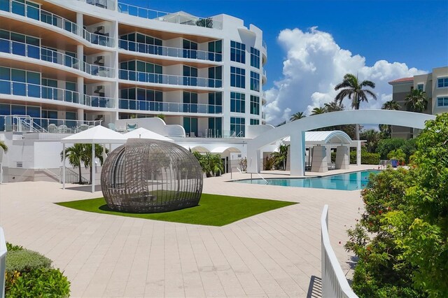 view of swimming pool featuring a patio