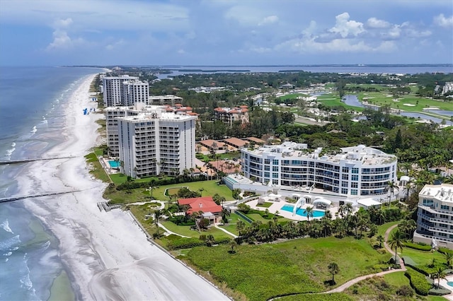 birds eye view of property featuring a water view and a view of the beach