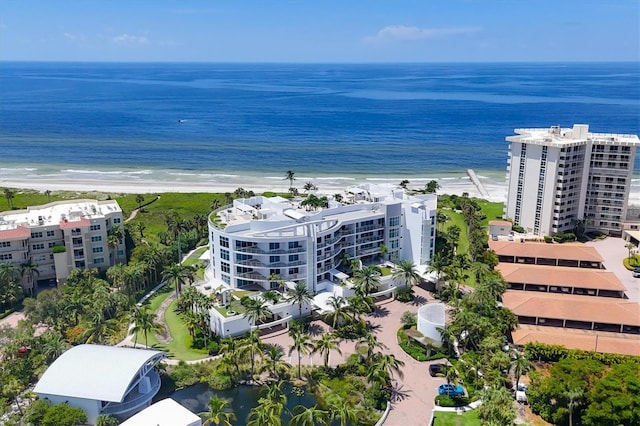 bird's eye view with a water view and a view of the beach