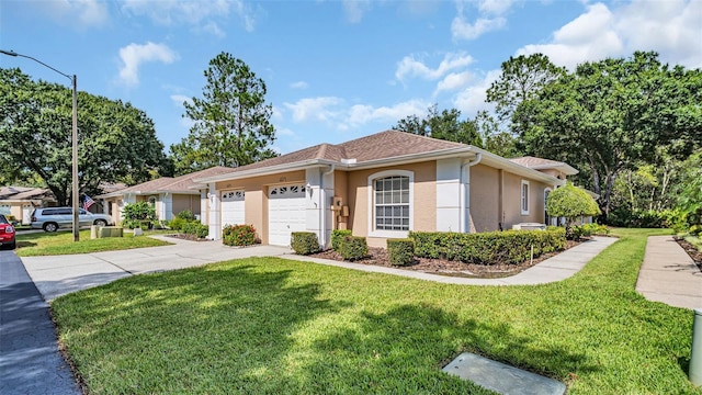 view of front of house featuring a garage and a front yard