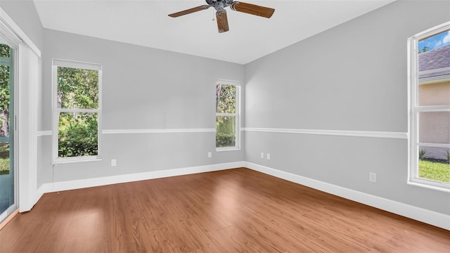 unfurnished room featuring hardwood / wood-style floors and ceiling fan