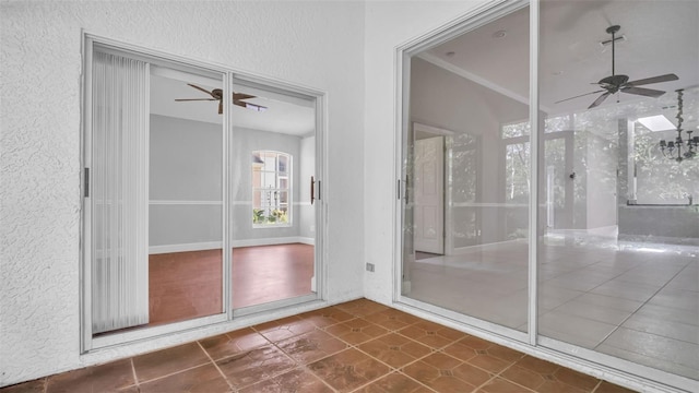 interior space with ceiling fan