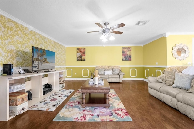 living room featuring ornamental molding, dark hardwood / wood-style floors, and ceiling fan