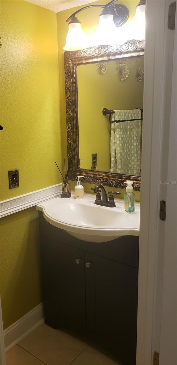 bathroom featuring vanity and tile patterned flooring