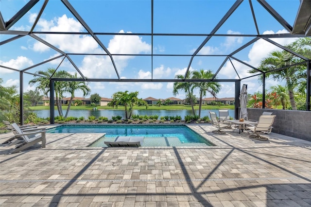 view of swimming pool with a water view, a patio, and a lanai