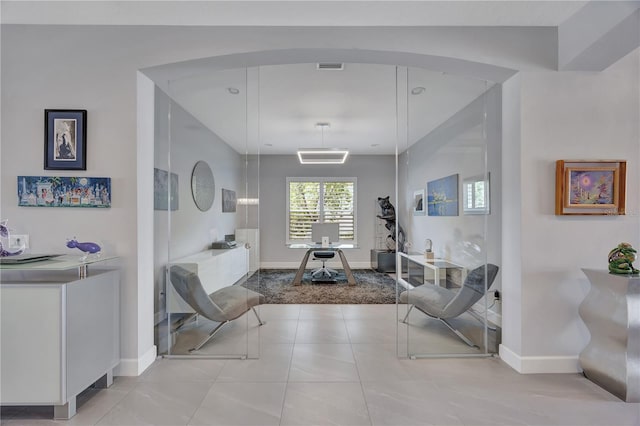 living area with light tile patterned flooring