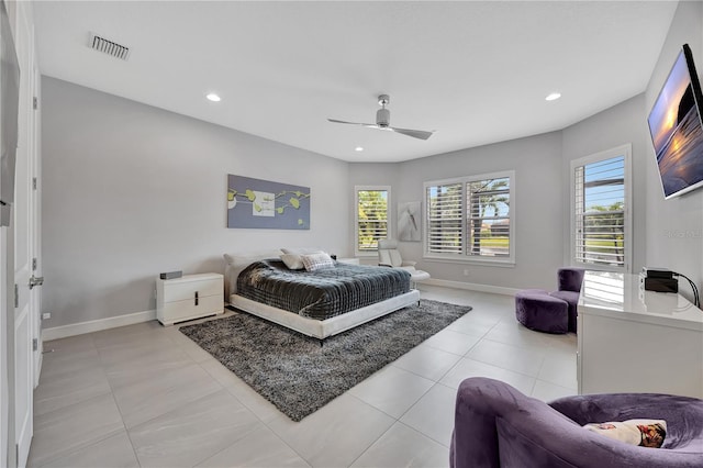 bedroom featuring light tile patterned floors and ceiling fan