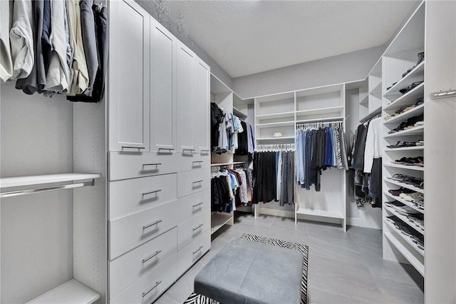 walk in closet featuring light tile patterned floors