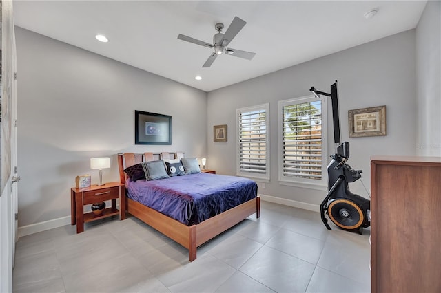 tiled bedroom featuring ceiling fan