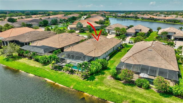 birds eye view of property with a water view