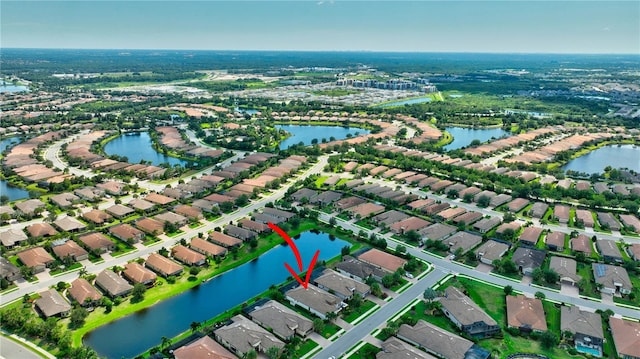 birds eye view of property featuring a water view