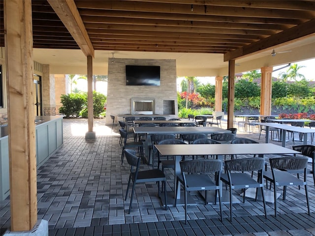 view of patio / terrace featuring exterior fireplace