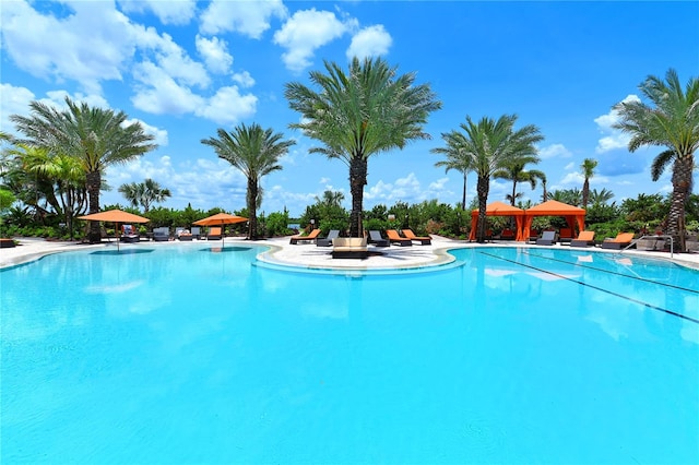 view of swimming pool with a patio and a gazebo