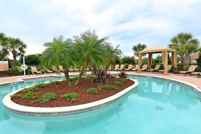 view of swimming pool featuring a gazebo