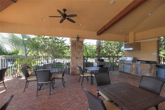 view of patio featuring an outdoor kitchen, a grill, and ceiling fan