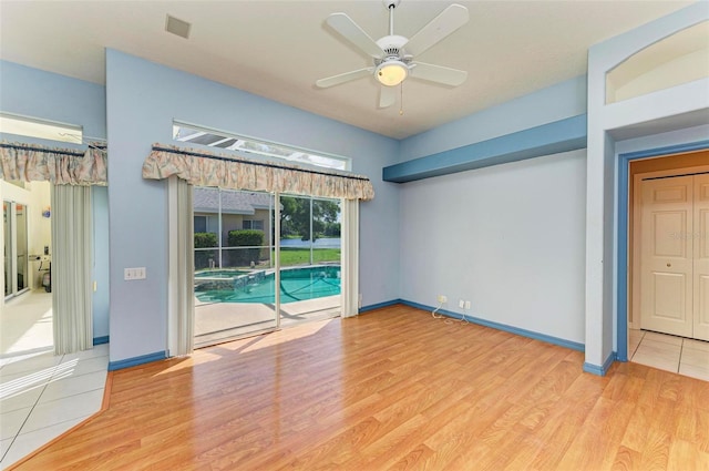 interior space with hardwood / wood-style flooring and ceiling fan